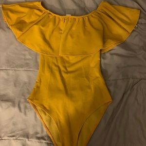 yellow body suit